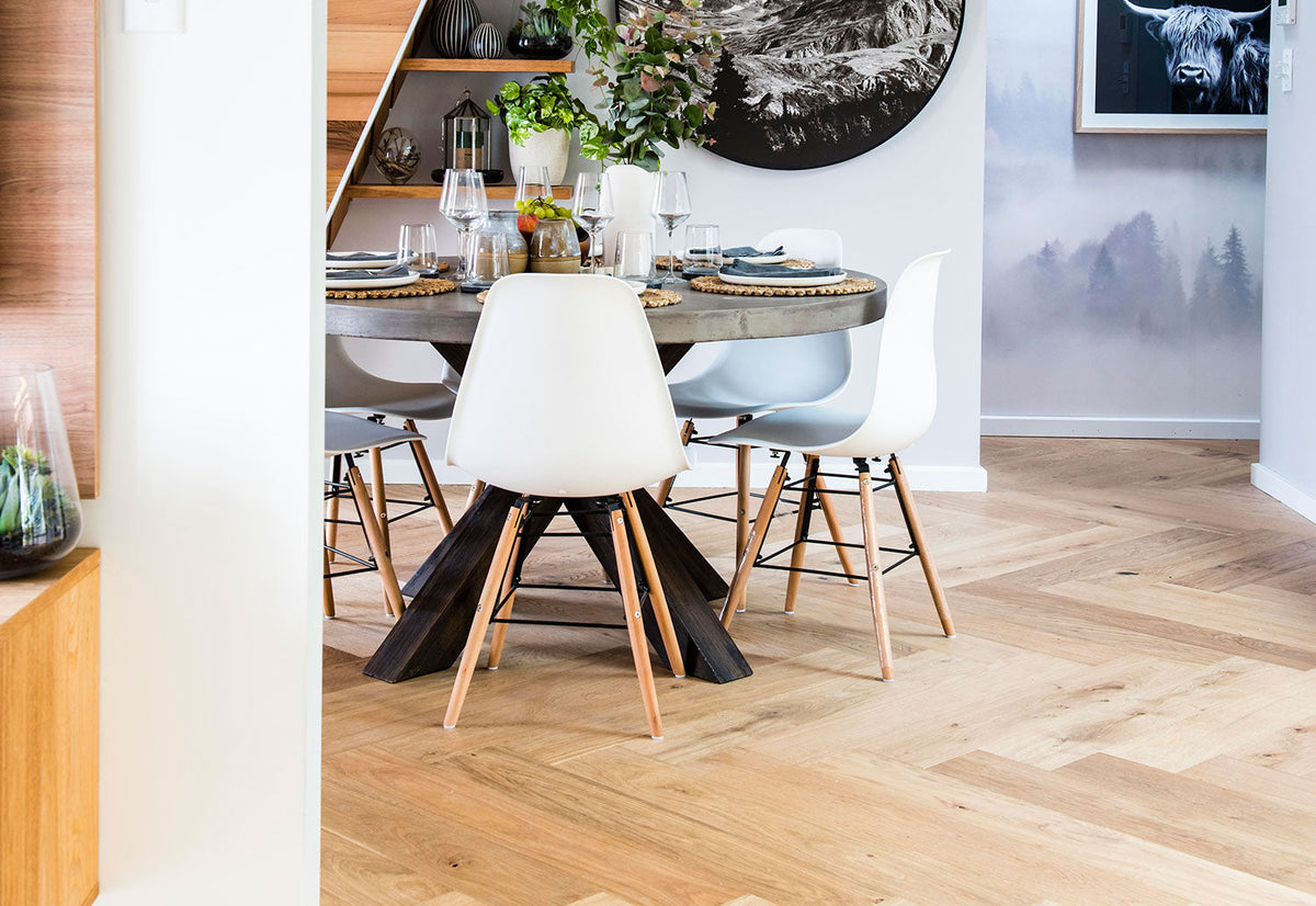 Dining room with timber-look herringbone flooring